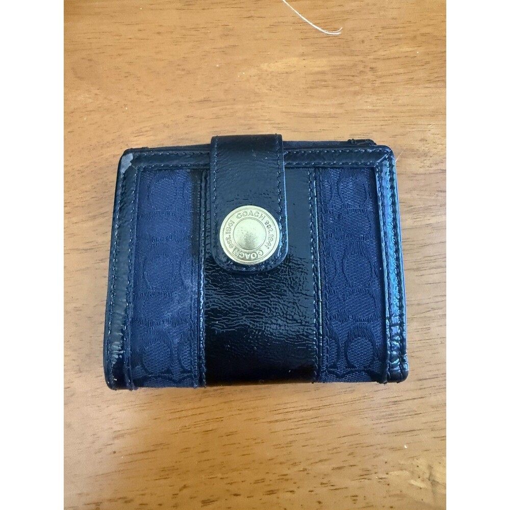 COACH Authentic Black SignatureJacquard Monogram Trifold Leather Wallet.